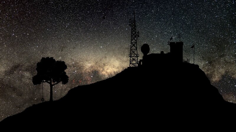 Starry night over hilltop station
