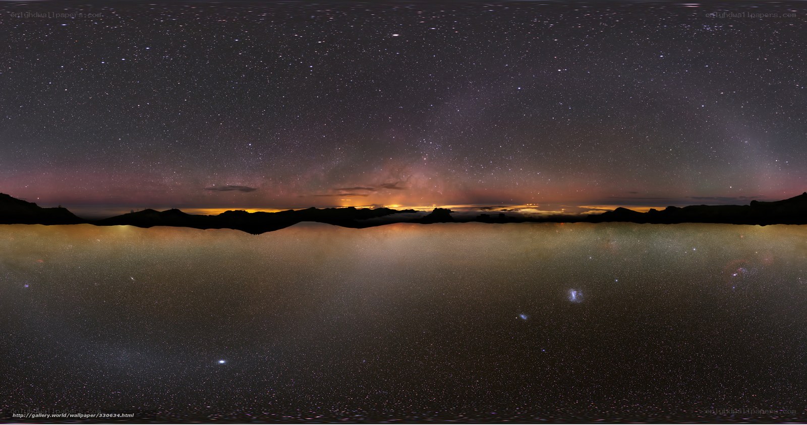 Starry night over mountain lake