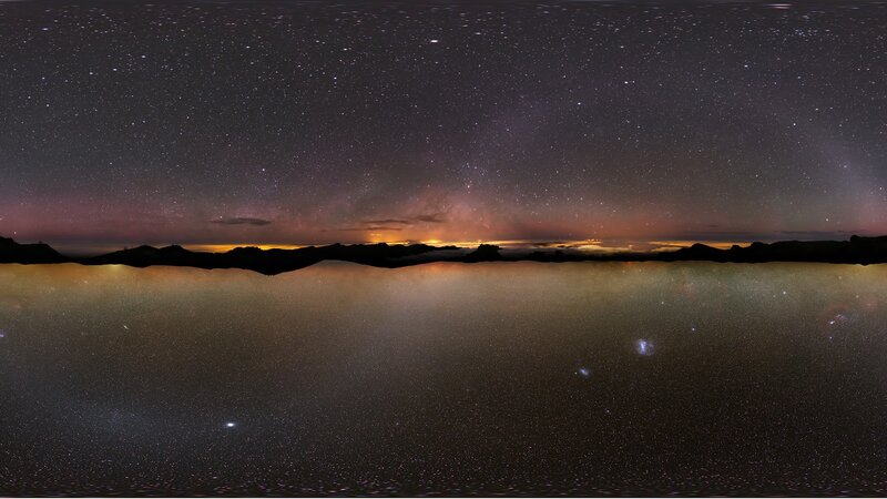 Starry night over mountain landscape