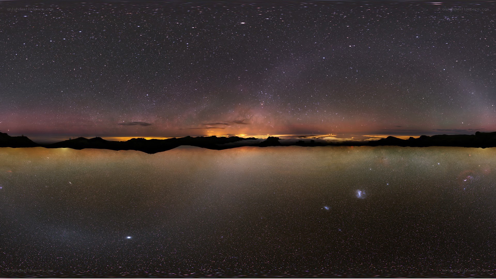 Starry night over mountain landscape