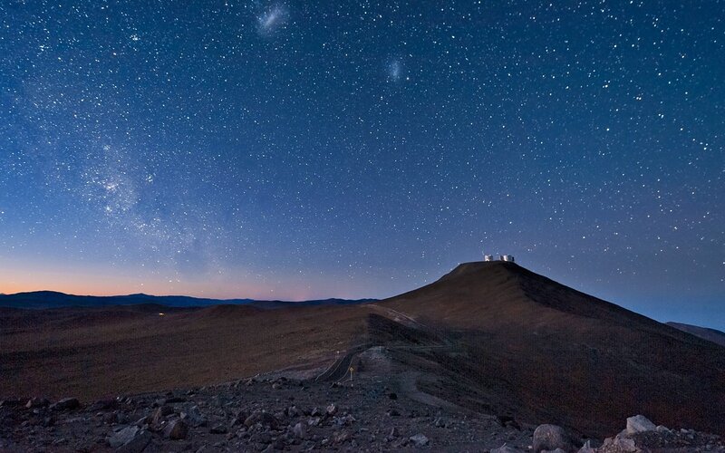 Starry night over mountain observatory
