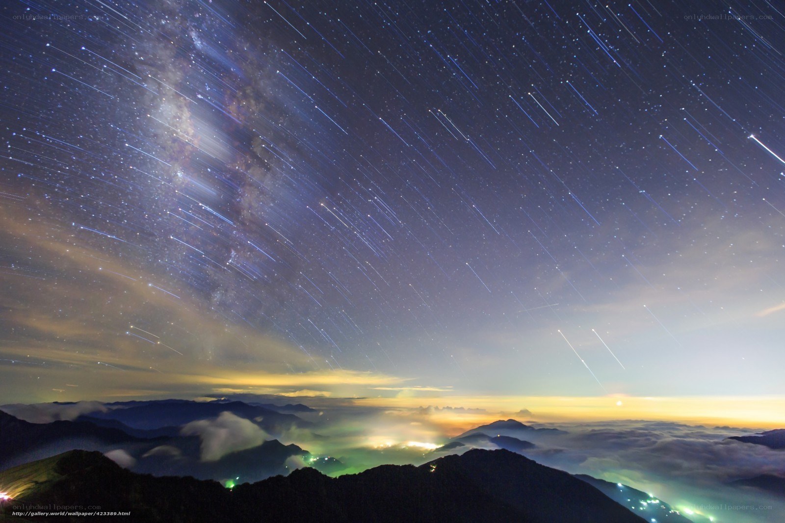Starry night over mountain peaks