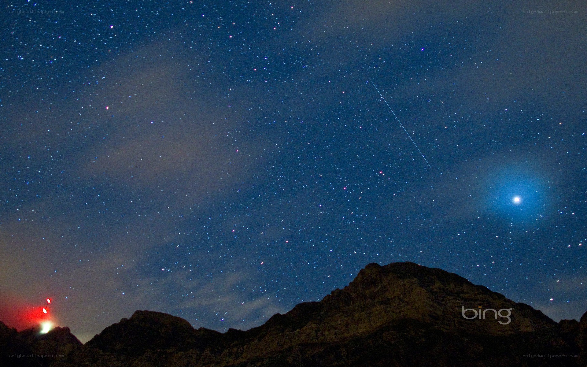 Starry night over mountain peaks