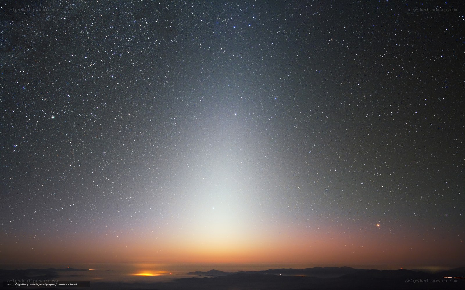 Starry night over mountain peaks