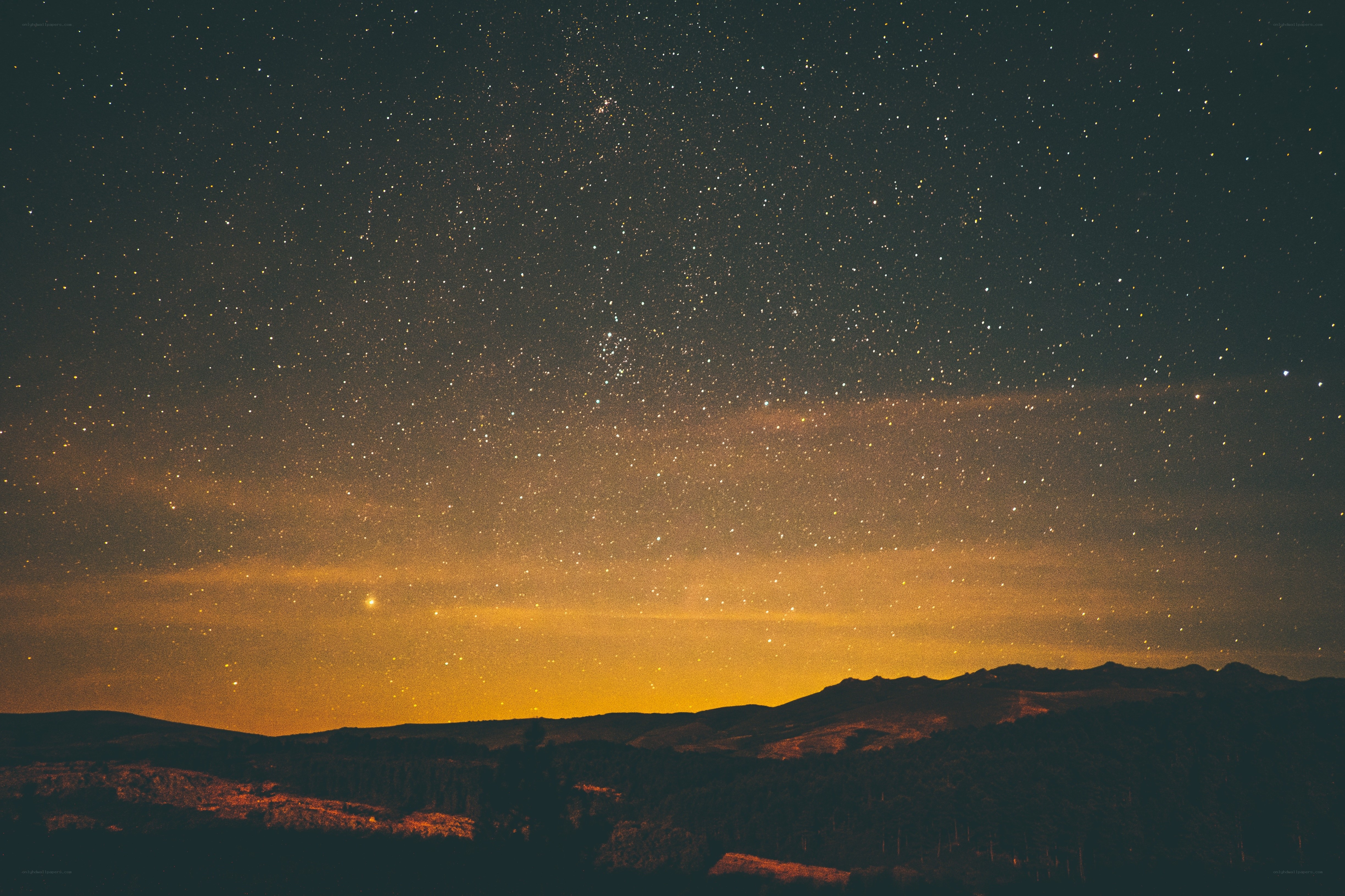 Starry night over mountains