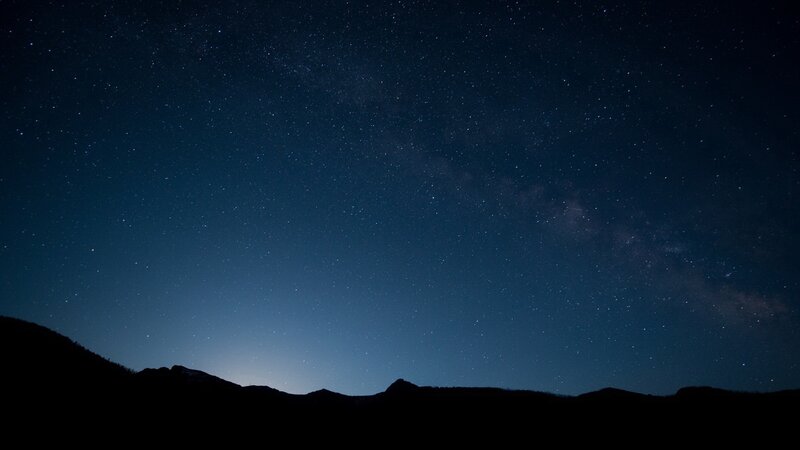 Starry night over mountains
