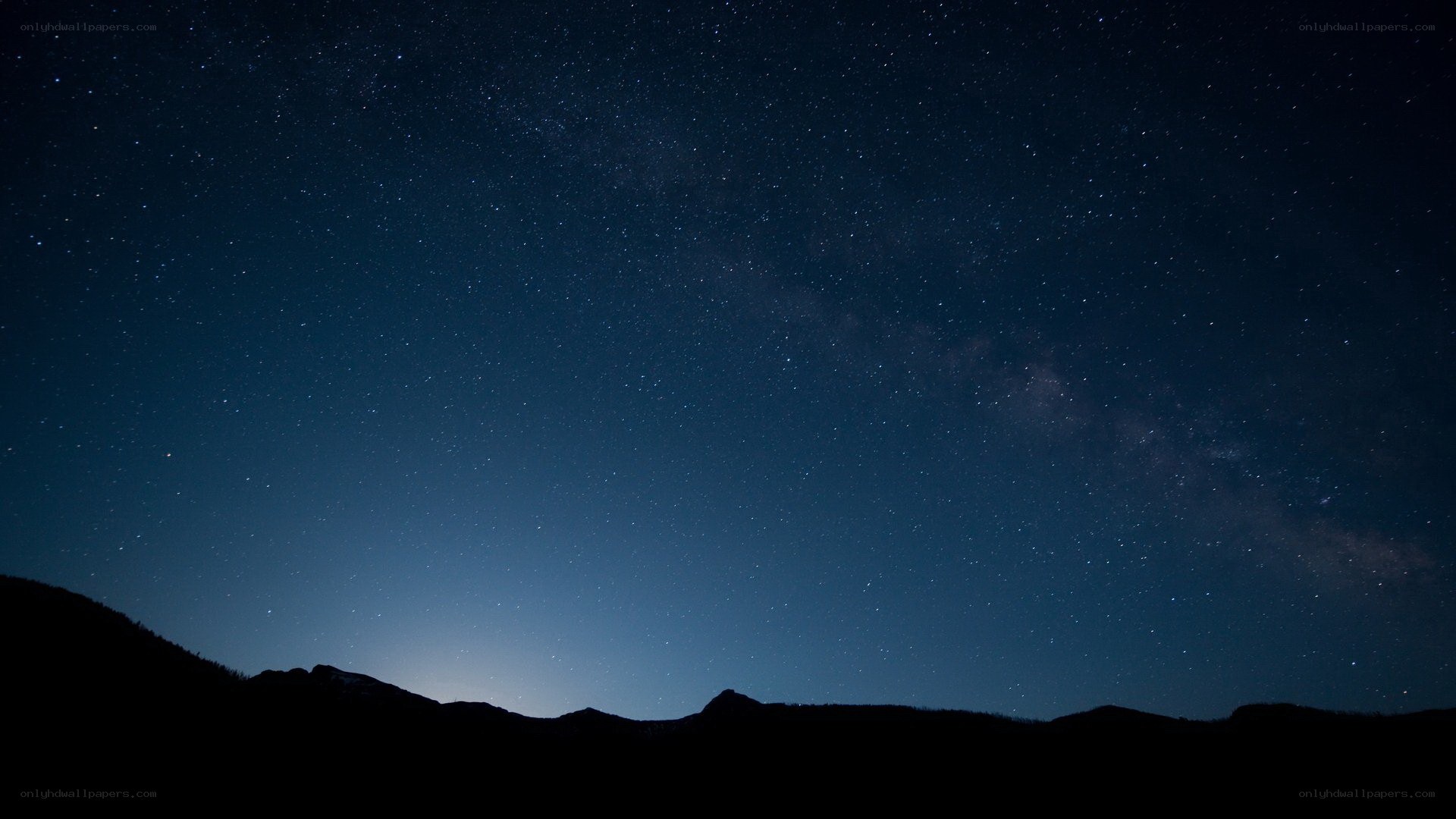 Starry night over mountains