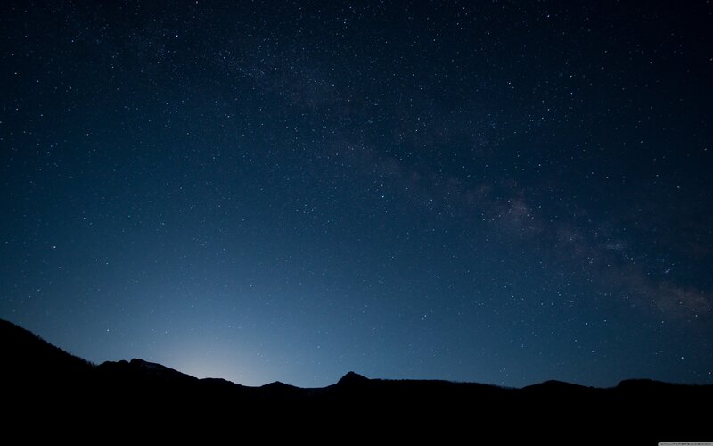 Starry night over mountains