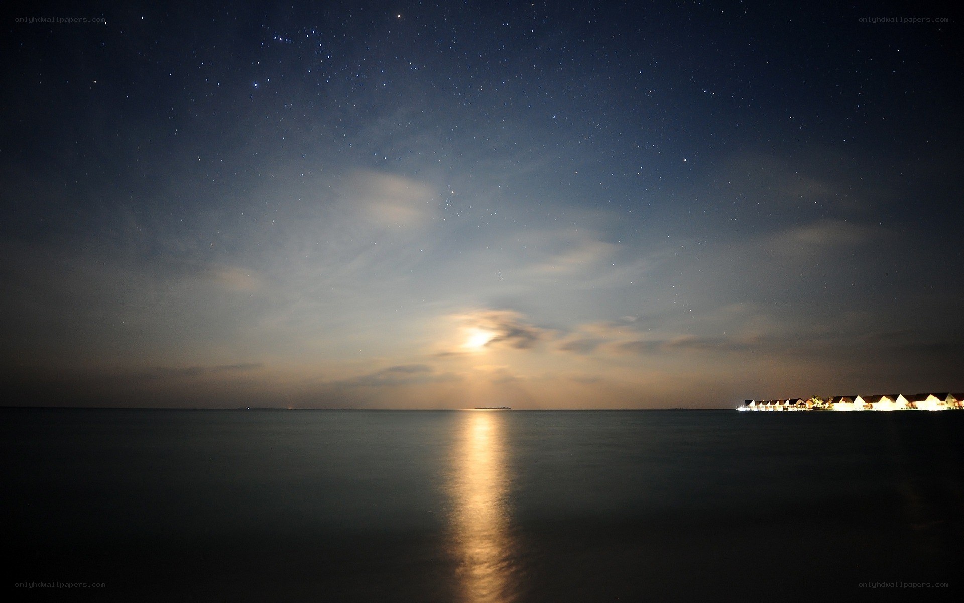 Starry night over ocean resort