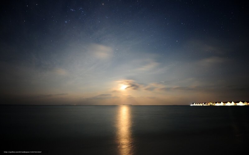 Starry night over ocean resort