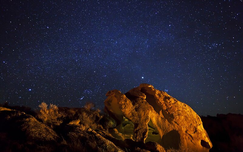Starry night over rock formation