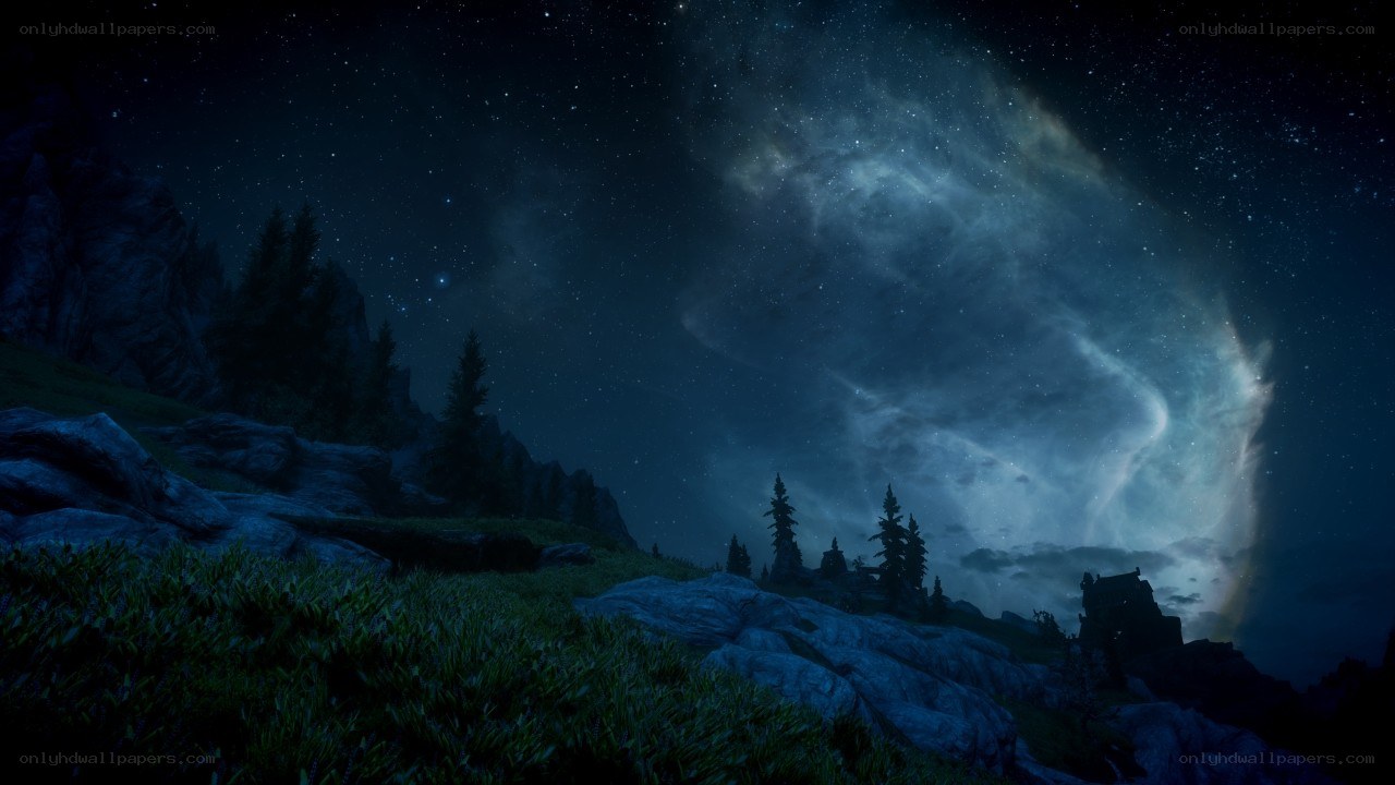 Starry night over rocky hills
