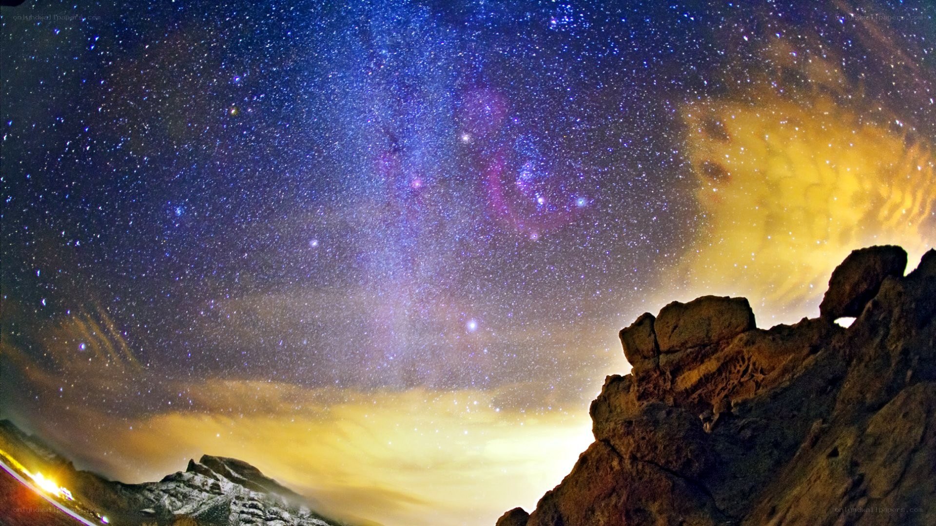 Starry night over rocky landscape