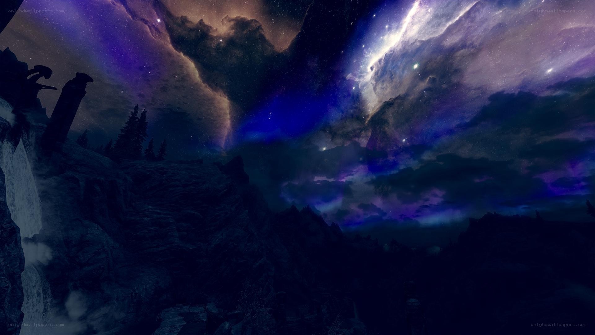 Starry night over rocky landscape