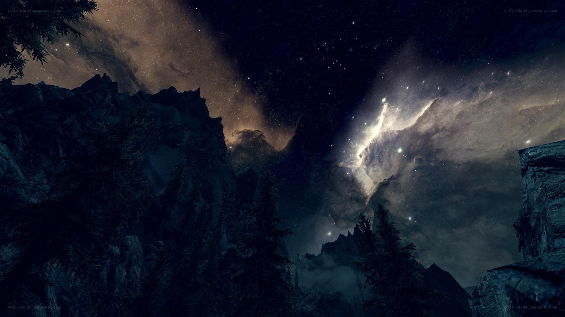 Starry night over rocky mountains