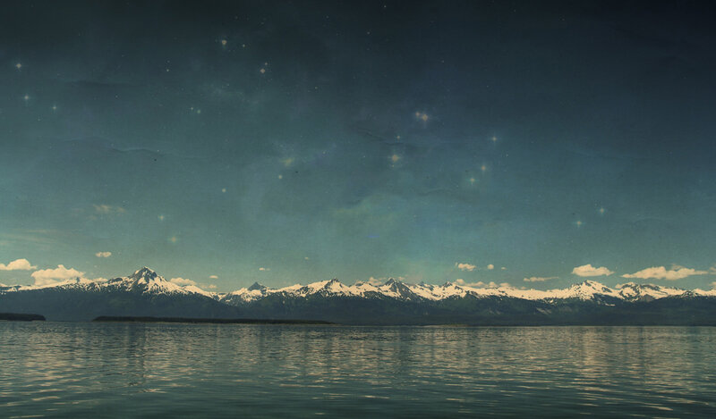 Starry night over snowy mountains