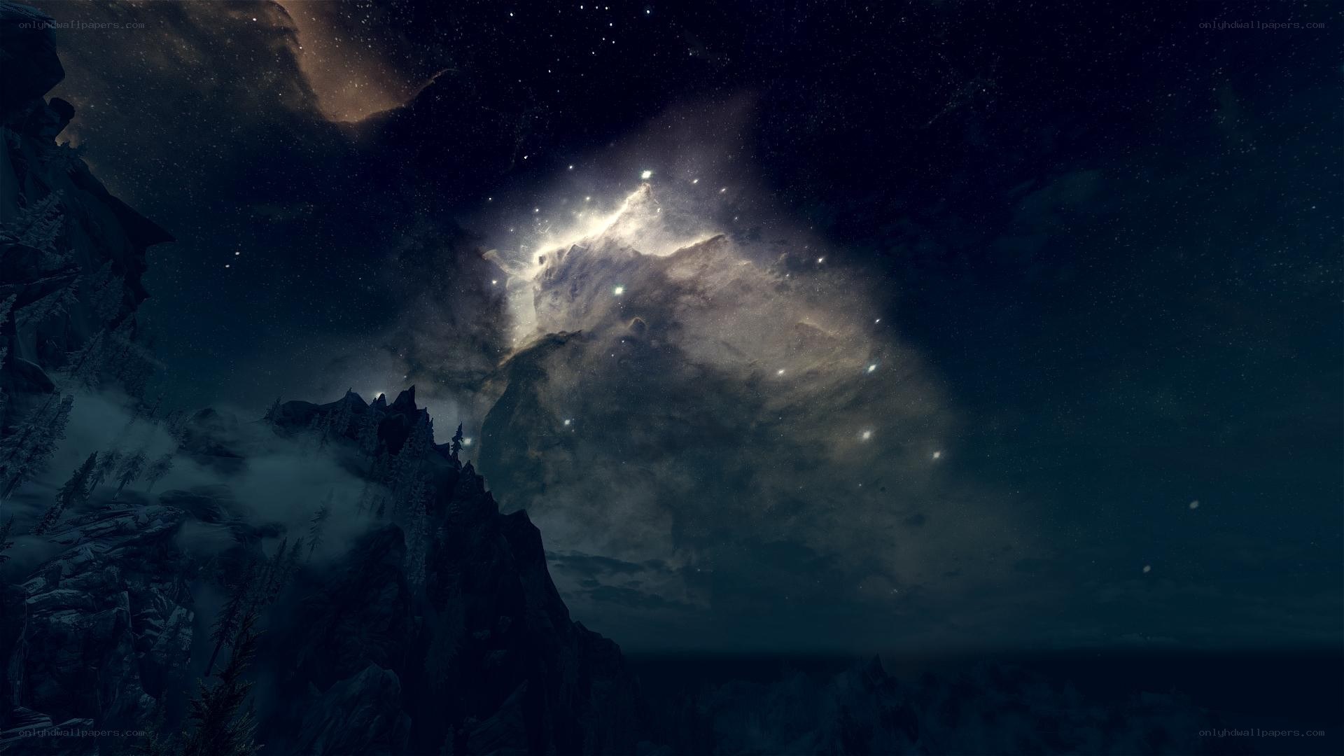 Starry night over snowy mountains