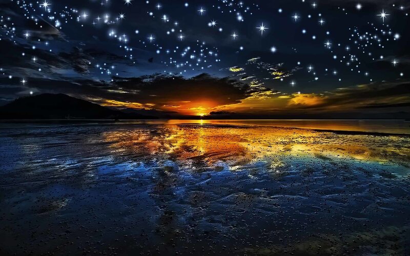 Starry night over sunset beach
