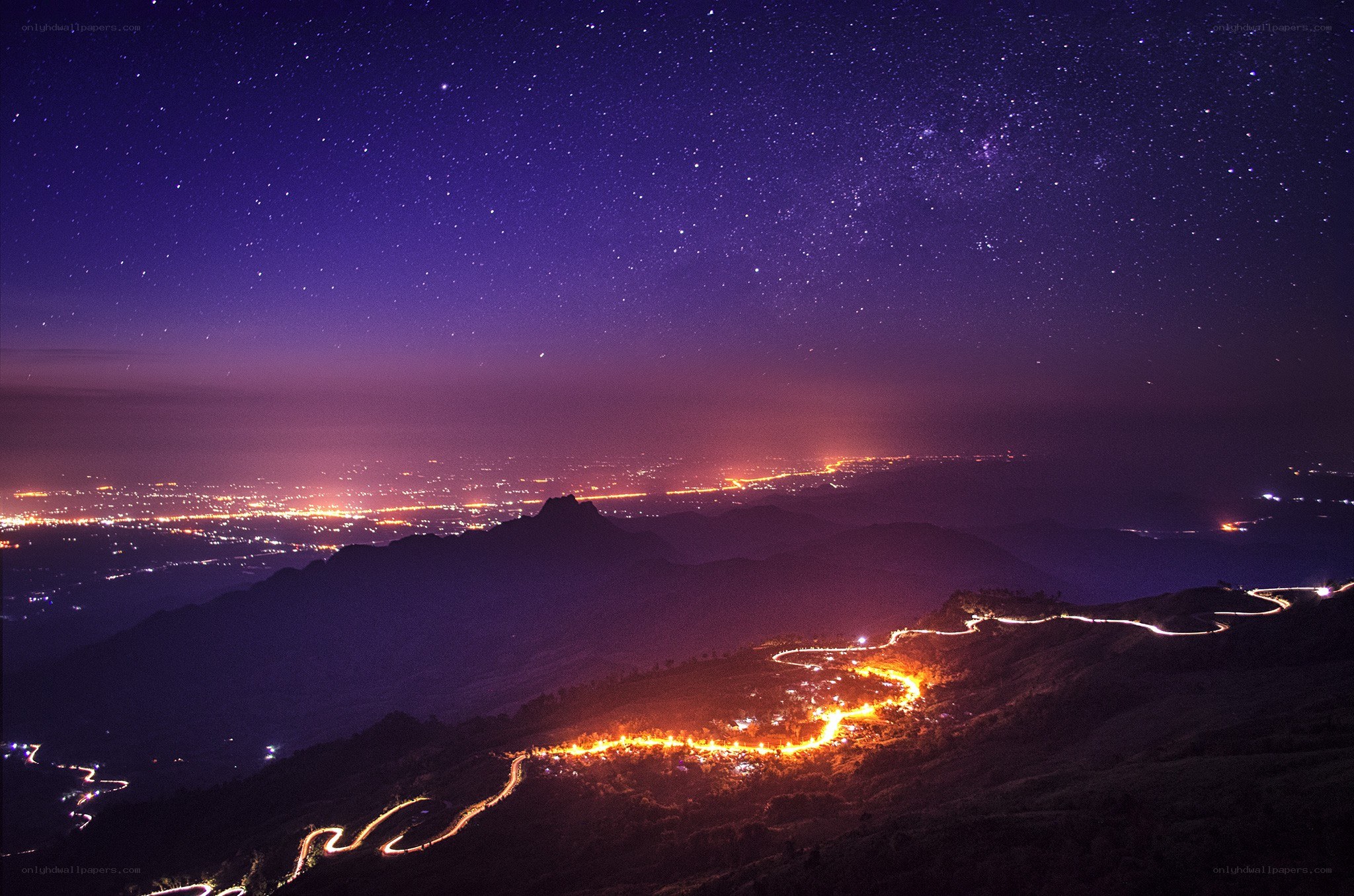 Starry night over winding roads