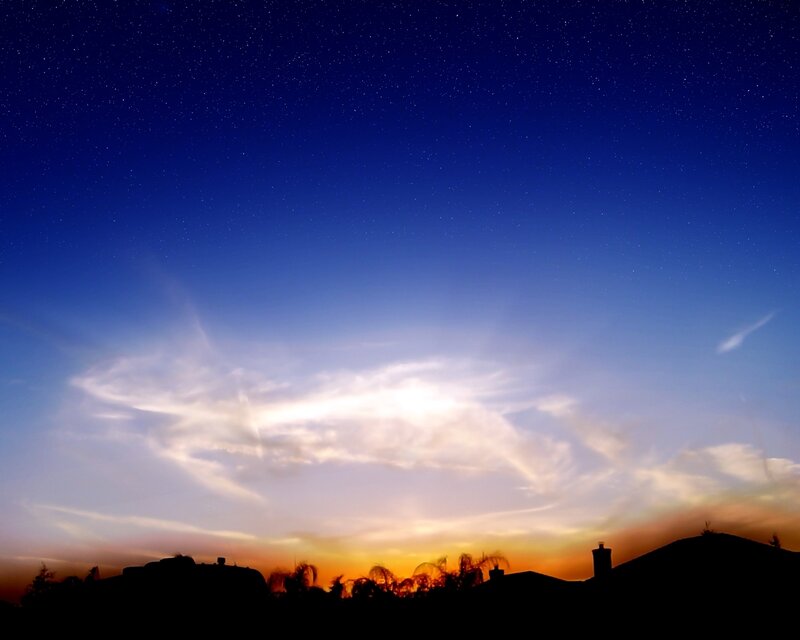 Starry night sky with clouds