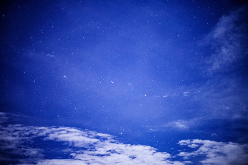 Starry night sky with clouds