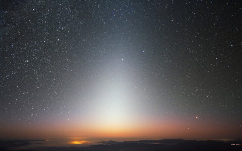 Starry night sky with light beam