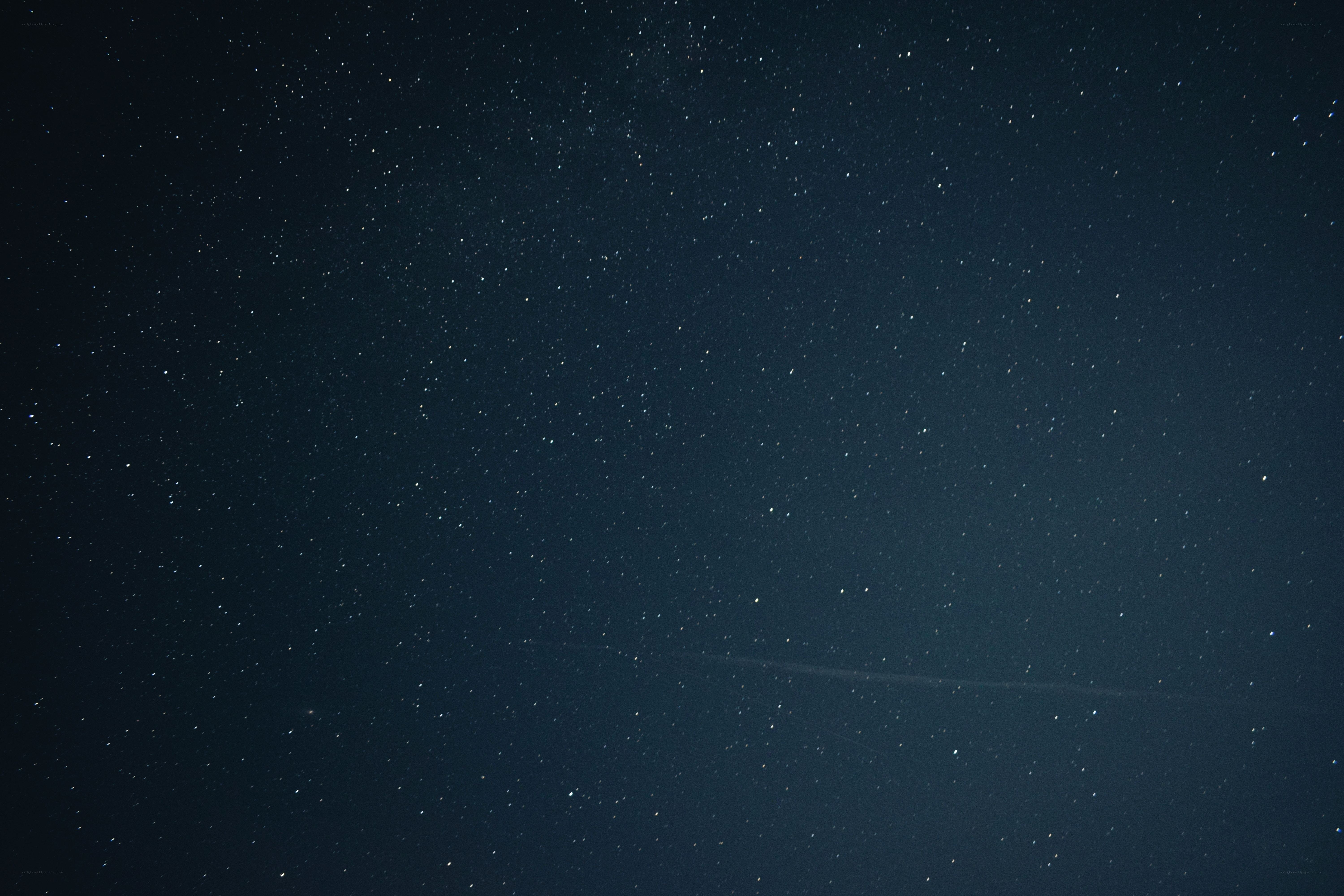 starry night sky with meteor