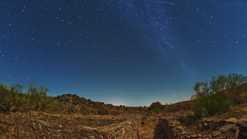 Starry night with meteor shower