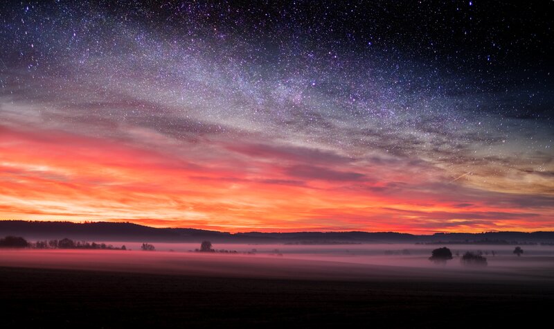 Starry Sky over Foggy Field