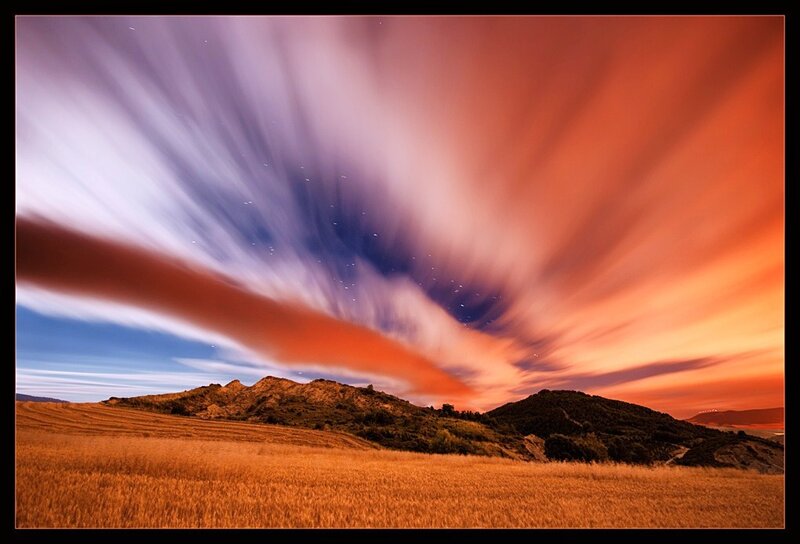 Starry sky over golden fields