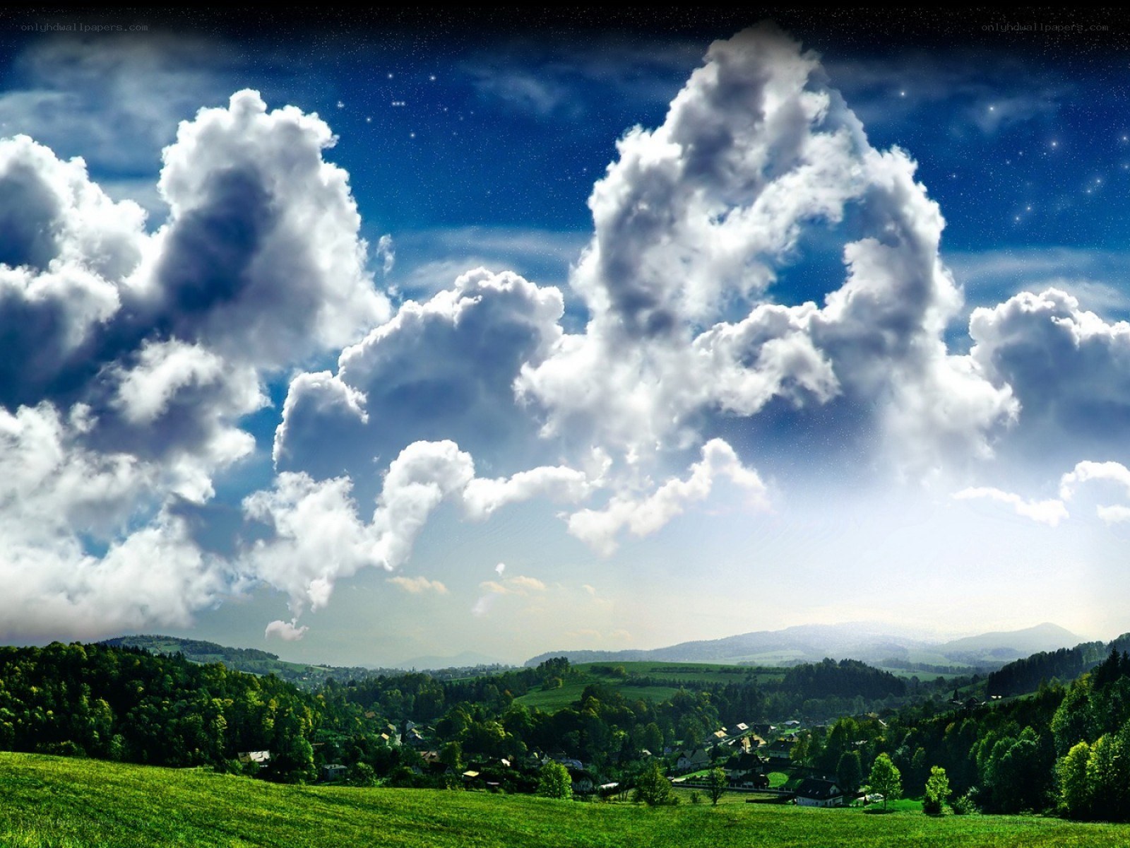 Starry sky over green hills