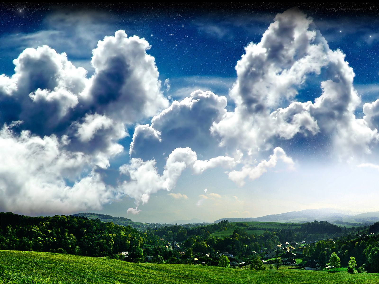 Starry sky over green hills