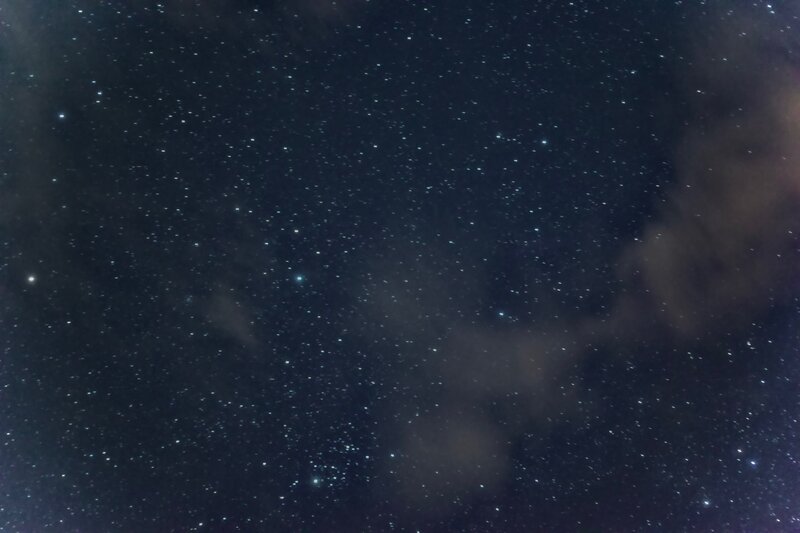 Stars and clouds in night sky