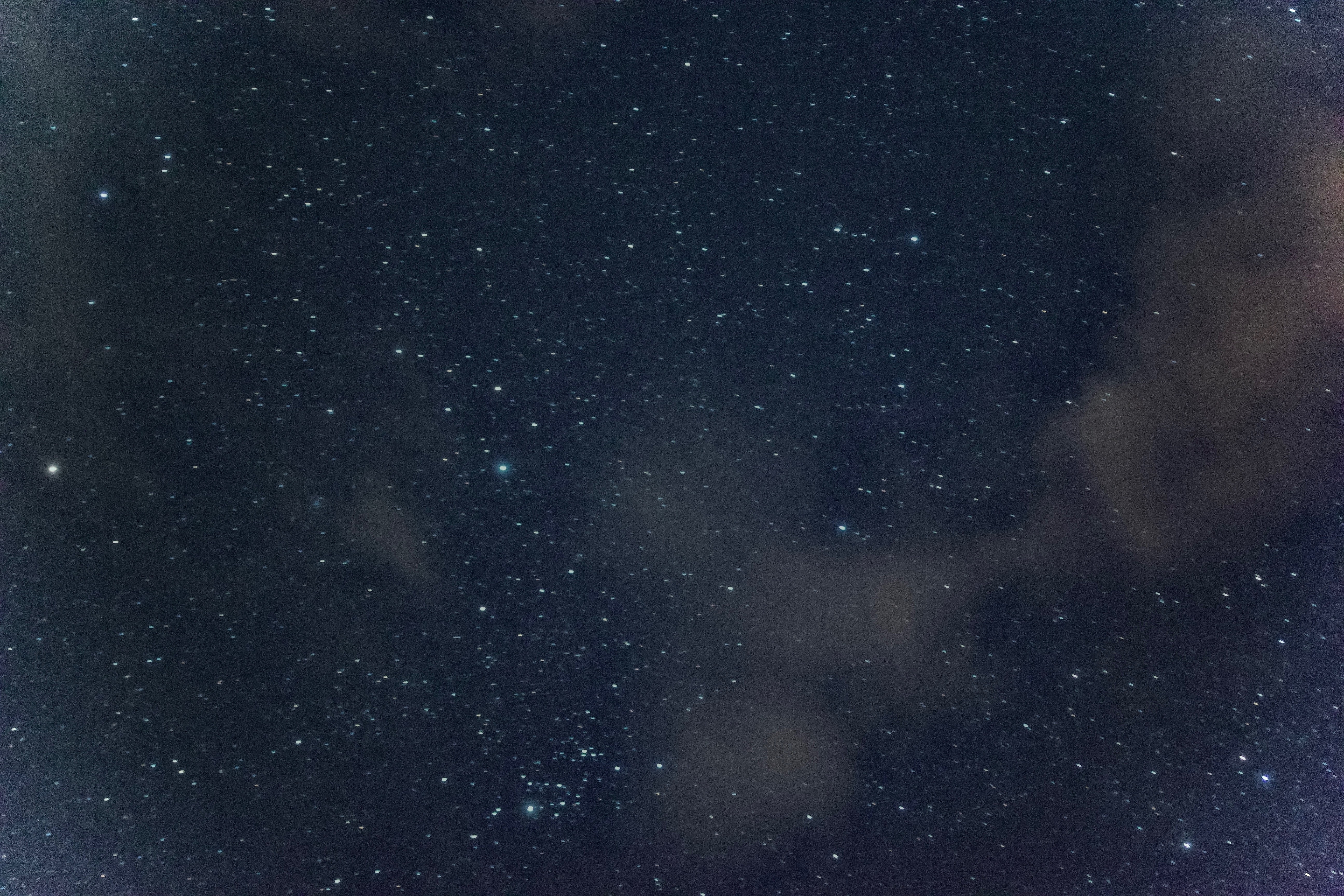 Stars and clouds in night sky