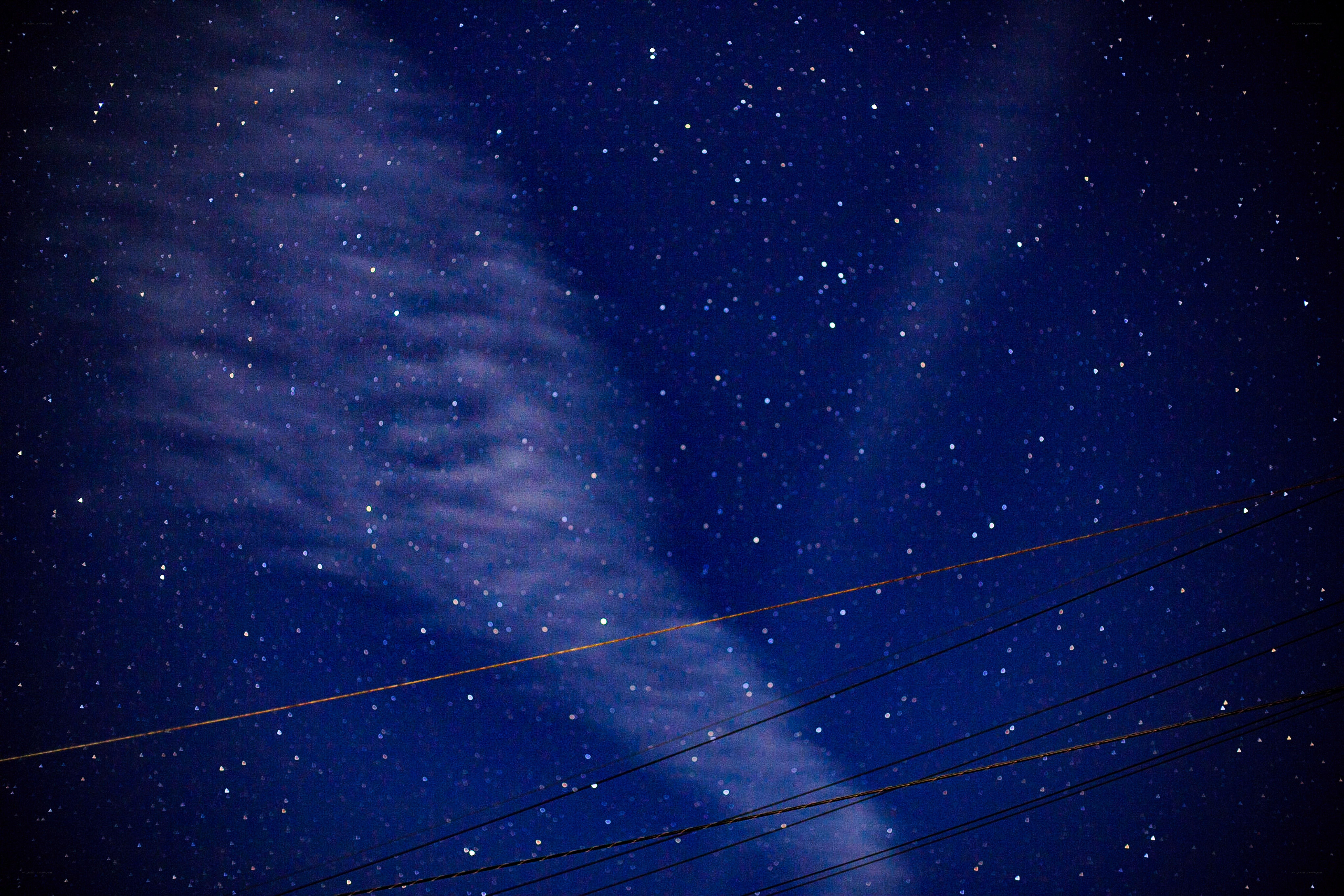 Stars and power lines at night