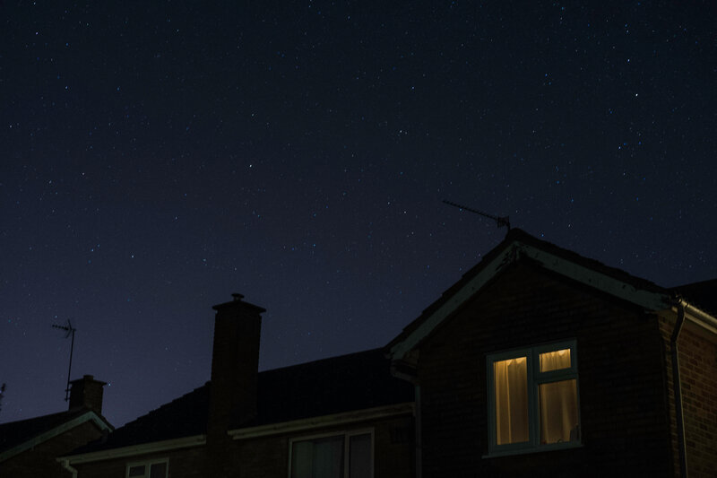 Stars over a house at night