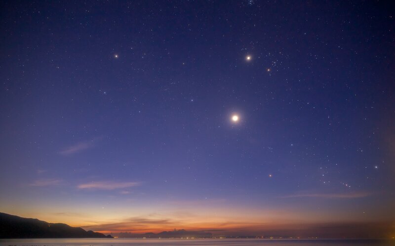Stars over the sea at dusk