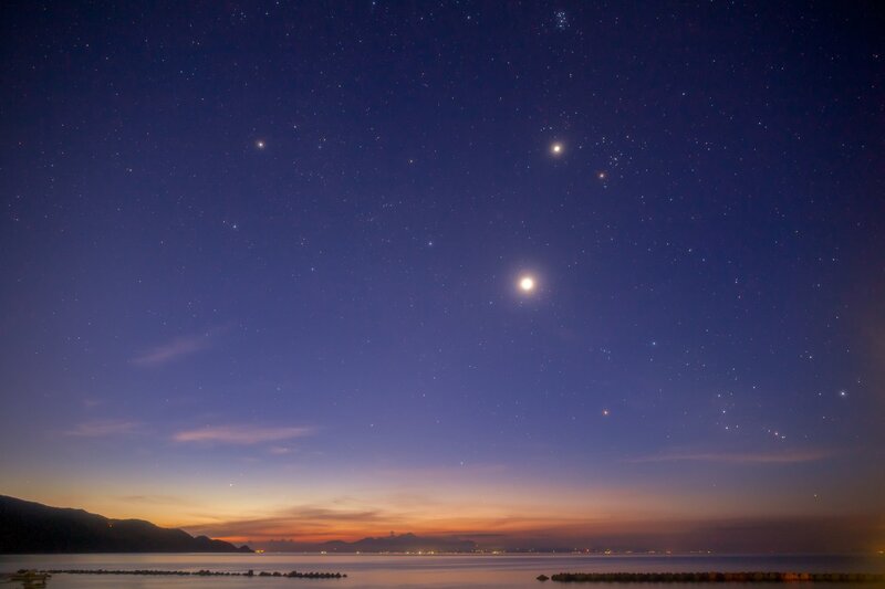 Stars over the sea at dusk