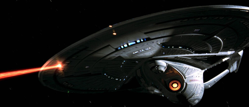 Starship firing a red beam