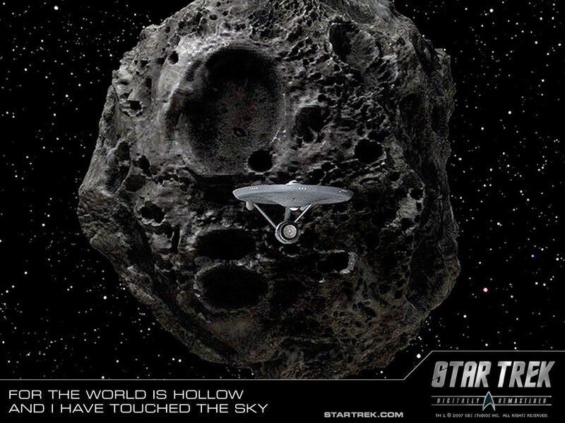 Starship near hollow asteroid