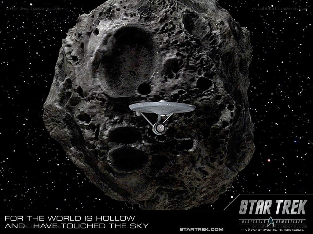 Starship near hollow asteroid