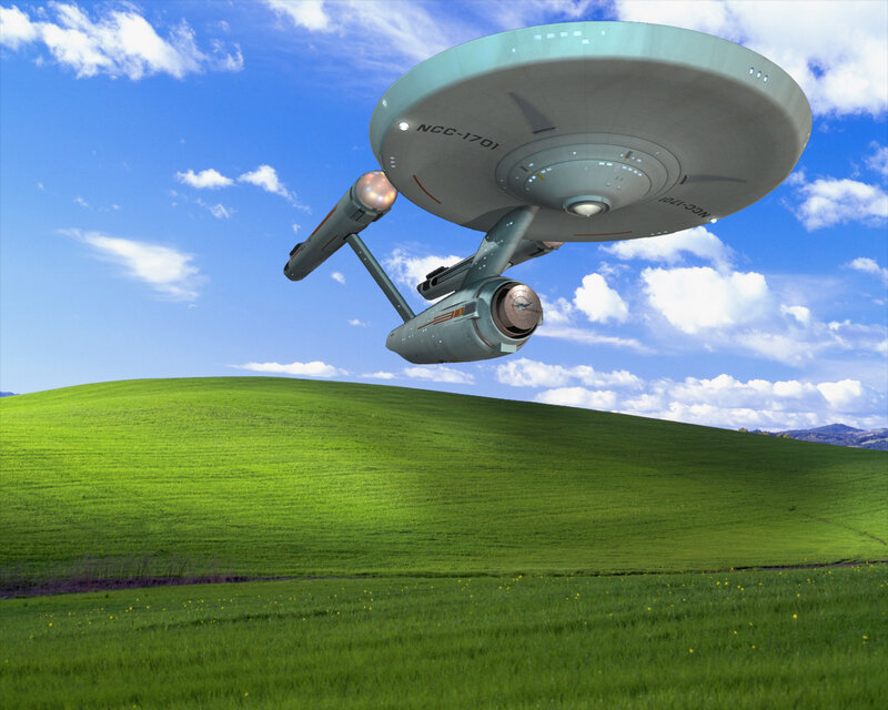 Starship over green hills