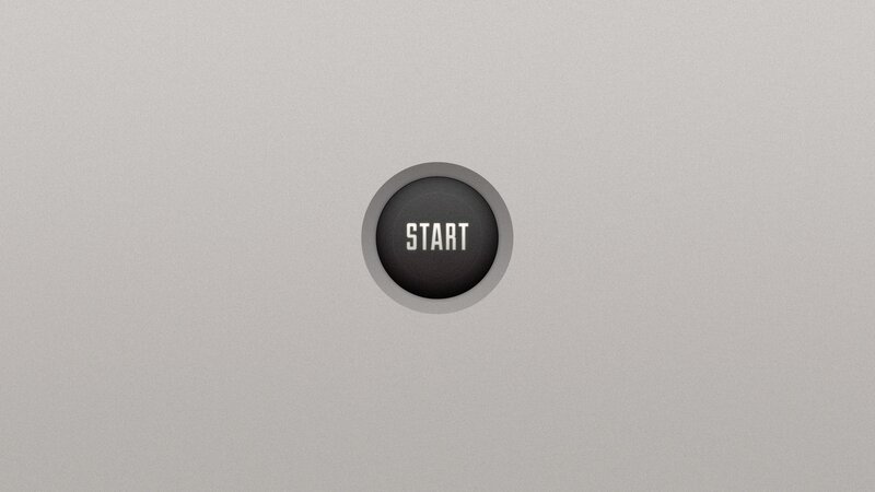 start button on gray surface