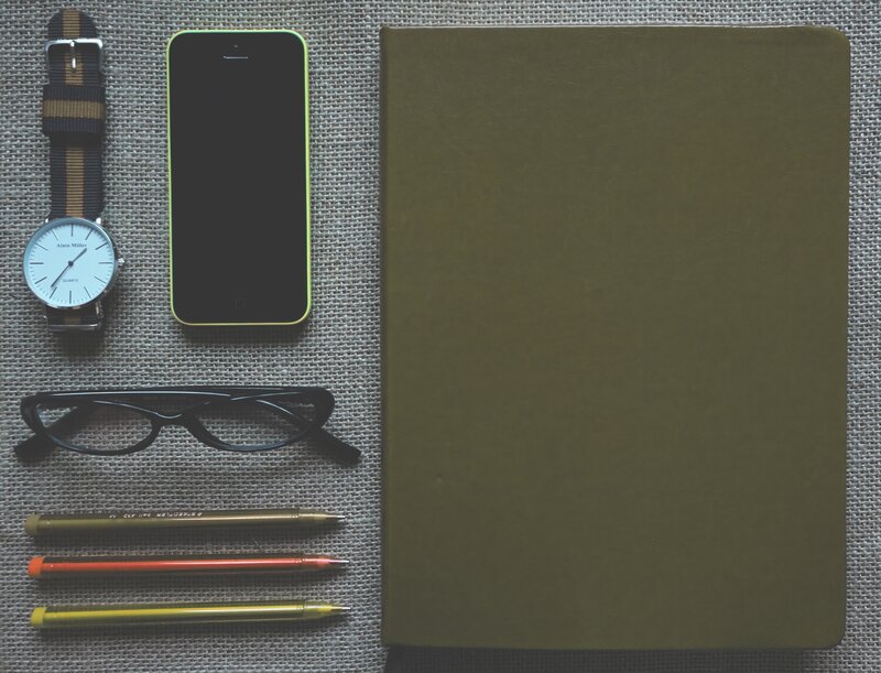 stationery and phone on fabric