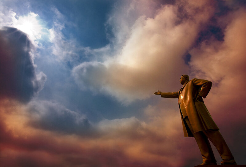 Statue against a dramatic sky