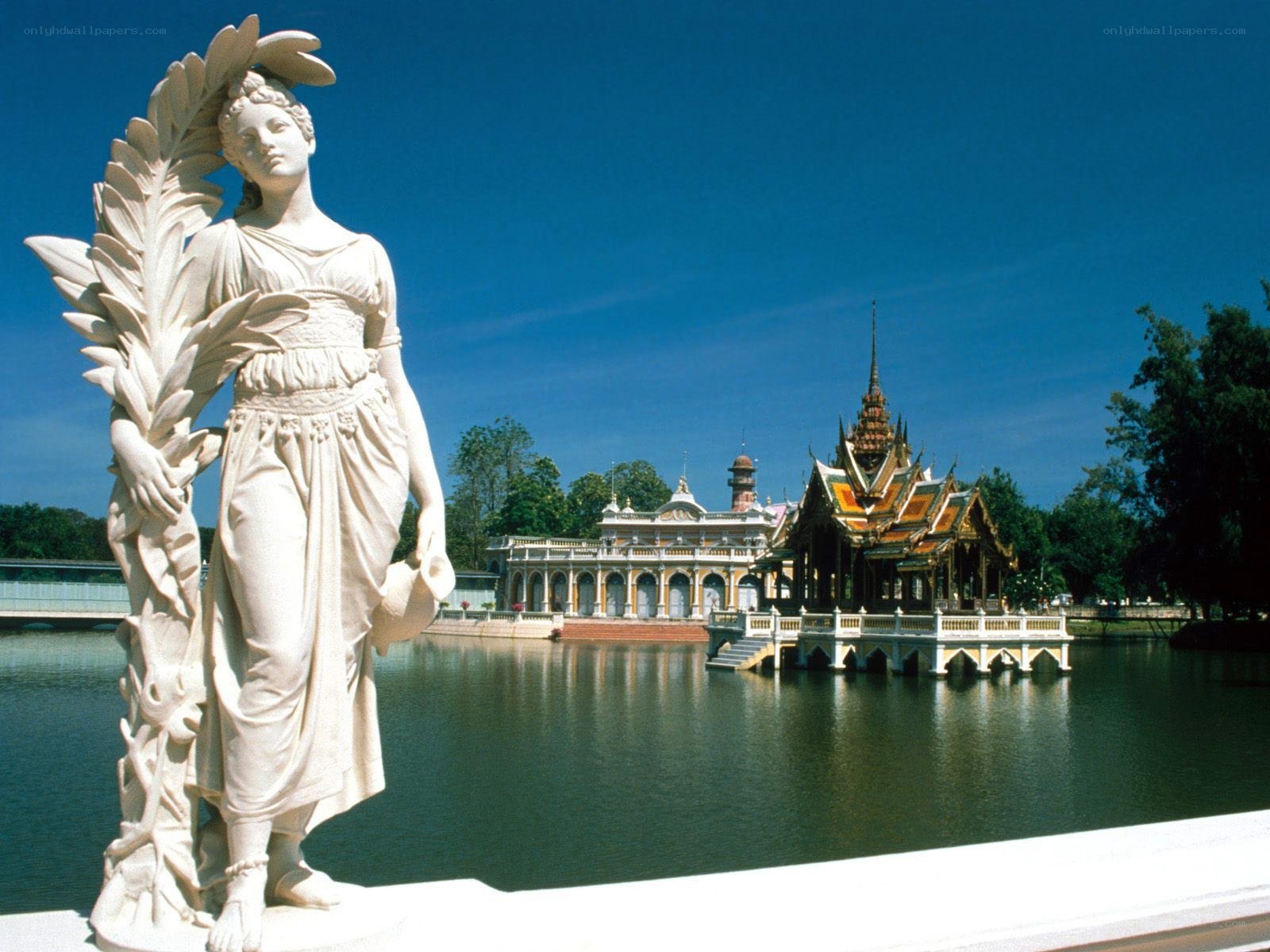 Statue and palace by a lake