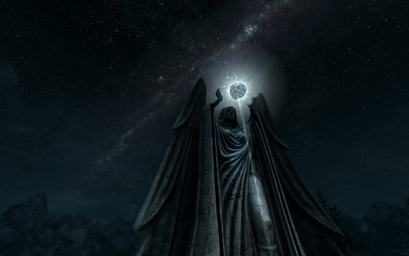 Statue Holding Glowing Orb — Black