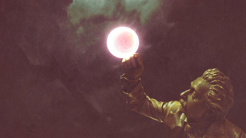 Statue Holding Glowing Orb — Gold