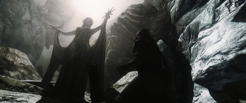 statue in a dark cave