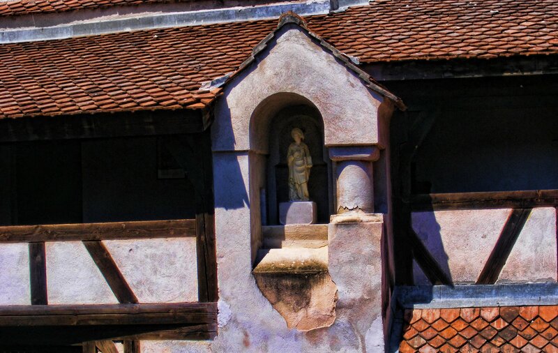 statue in a niche on a building